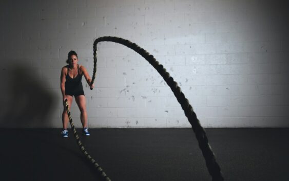 woman holding brown ropes